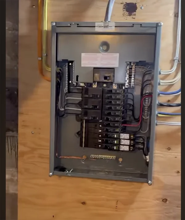 Panel Breaker panel with wiring mounted on plywood